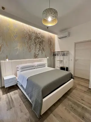 Letto o letti in una camera di Le Dimore di Lorenzo
