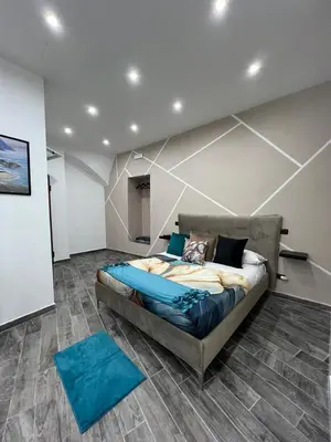 Letto o letti in una camera di Arco dei Borboni