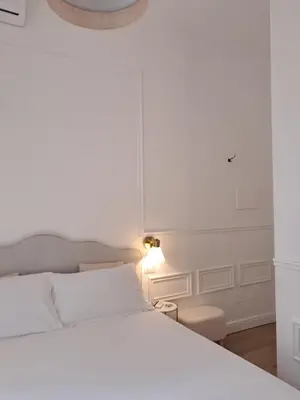Letto o letti in una camera di Domus Sirena