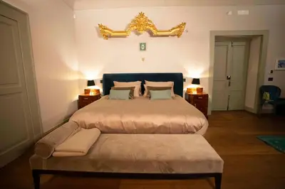 Letto o letti in una camera di Palazzo Carafa Santangelo