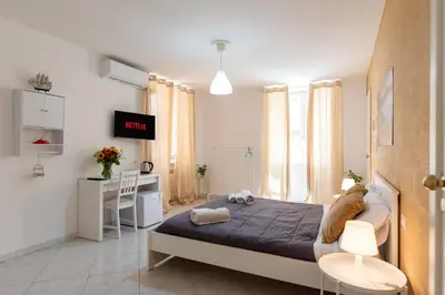 Letto o letti in una camera di Napoli centro, DM suites