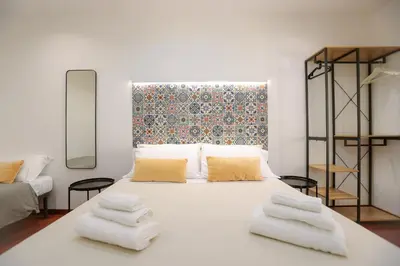 Letto o letti in una camera di DOMUS Gallery