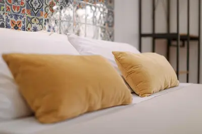 Letto o letti in una camera di DOMUS Gallery
