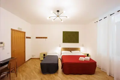 Letto o letti in una camera di Dante Apartament for Group and Family By HouseinNaples