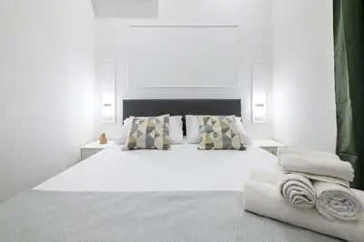 Letto o letti in una camera di Giordano Suite Center
