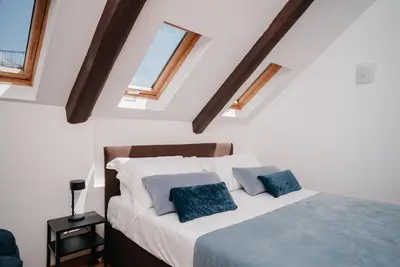 Letto o letti in una camera di Un Posto al Duomo