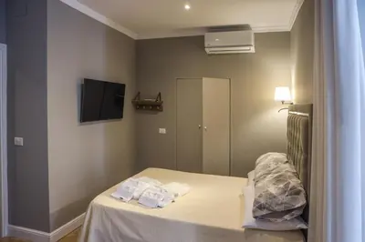 Letto o letti in una camera di Salvator Rooms