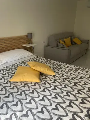 Letto o letti in una camera di Napoli a Piignatelli