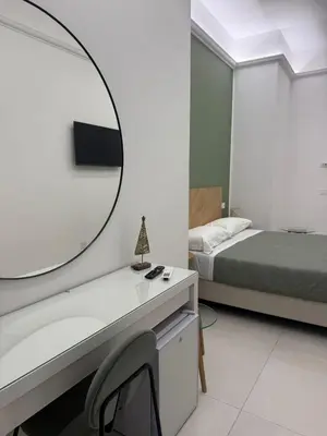 Letto o letti in una camera di Napoli a Piignatelli