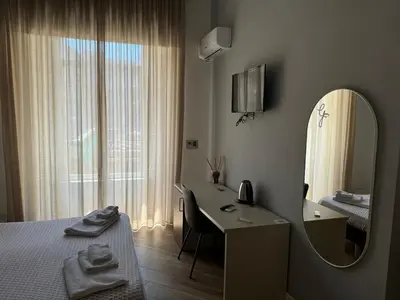 Letto o letti in una camera di Rooms Garibaldi