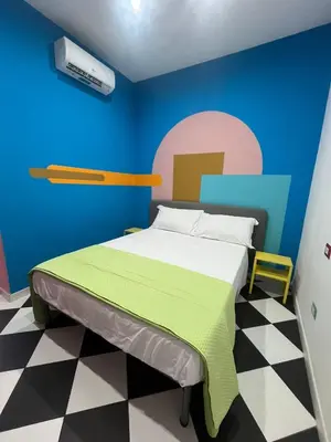 Letto o letti in una camera di Barrios Napoli