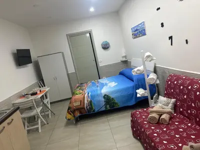 Letto o letti in una camera di B&B Rifugio Partenopeo - Centro Storico di Napoli