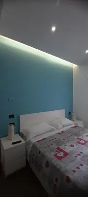 Letto o letti in una camera di B&B Locanda Mediterranea