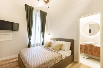 Letto o letti in una camera di Alfonsina Guest Room