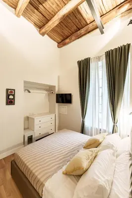 Letto o letti in una camera di Alfonsina Guest Room