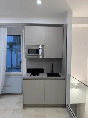 Cucina o angolo cottura di HV Suites TRIBUNALIUM