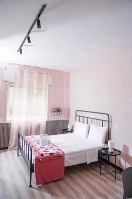 Letto o letti in una camera di Flower rooms