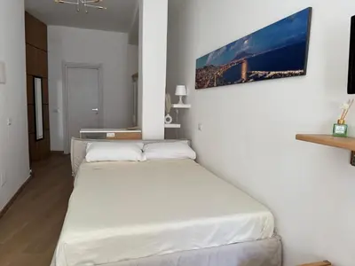 Letto o letti in una camera di La Casa di Ciui ad un passo da Via Toledo