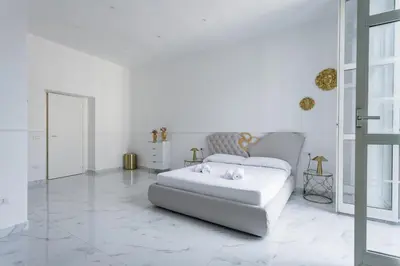 Letto o letti in una camera di Golden Suites by Dimorra