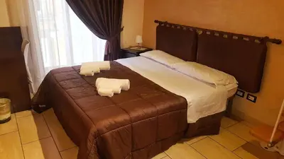 Letto o letti in una camera di Napolì Affittacamere