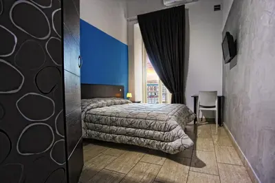 Letto o letti in una camera di Napolì Affittacamere