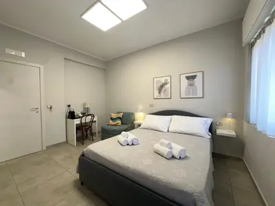 Letto o letti in una camera di Rossini 37