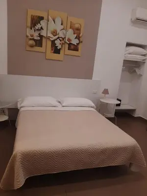 Letto o letti in una camera di La Baia Di Partenope