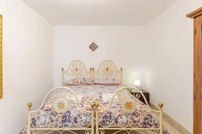 Letto o letti in una camera di La perla del Vesuvio