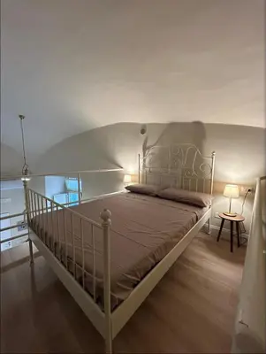 Letto o letti in una camera di Casa Diva A 5 passi dal Museo Archeologico