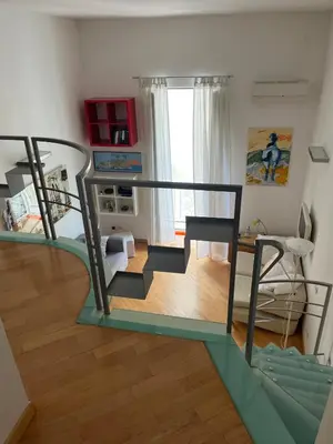 Letto o letti in una camera di Napolina House - Chiaia
