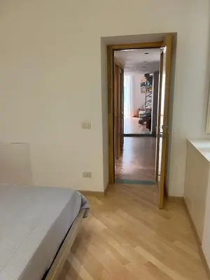 Letto o letti in una camera di Napolina House - Chiaia
