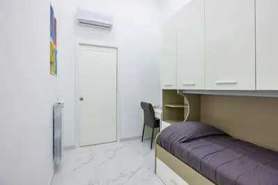 Letto o letti in una camera di Marcellino Comfort House by NapoliApartments