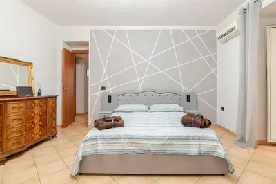 Letto o letti in una camera di NFA Nikyfigurellapartament