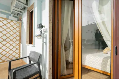 Letto o letti in una camera di LuLi Rooms Napoli