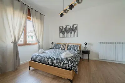 Letto o letti in una camera di LuLi Rooms Napoli
