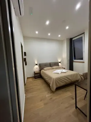 Letto o letti in una camera di Somnia Luxury Rooms