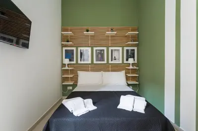 Letto o letti in una camera di Casa Papaccio Apartment & Spa By Dimorra