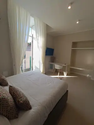 Letto o letti in una camera di Residenza Sansevero - Dimore Partenopee
