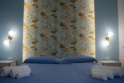 Letto o letti in una camera di WANDERLUST SPACCANAPOLI Points Of View
