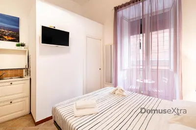 Letto o letti in una camera di Domus Mattei al Duomo By DomusExtra