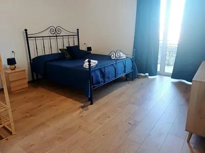 Letto o letti in una camera di Vesuvio&Partenope