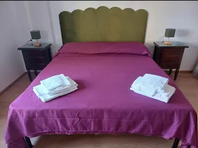 Letto o letti in una camera di Vesuvio&Partenope