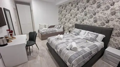 Letto o letti in una camera di B&B Murolo's Home