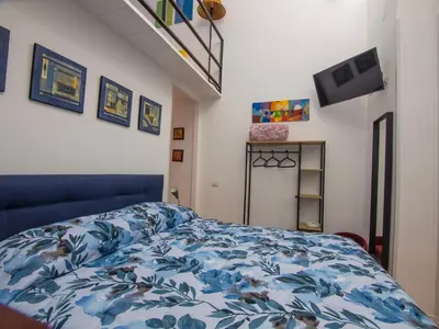 Letto o letti in una camera di Duomo Porto University Suite