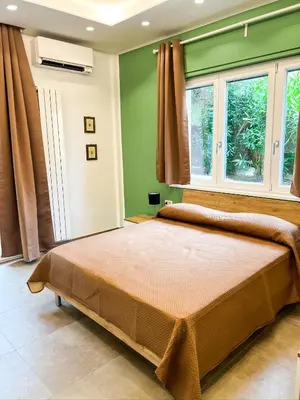 Letto o letti in una camera di Casa Momi Mergellina