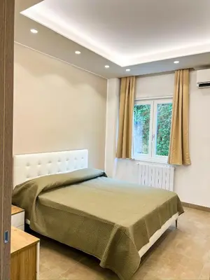 Letto o letti in una camera di Casa Momi Mergellina