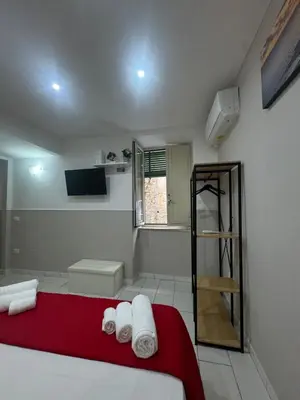 Letto o letti in una camera di Chez Moi Napoli