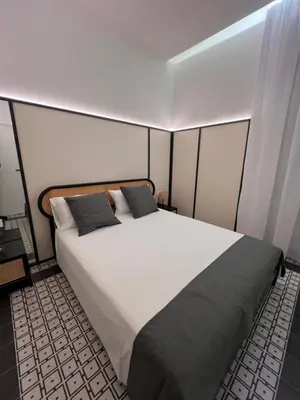 Letto o letti in una camera di Domus MARIA VITTORIA