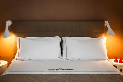 Letto o letti in una camera di The Napolitaner - Duomo Suite