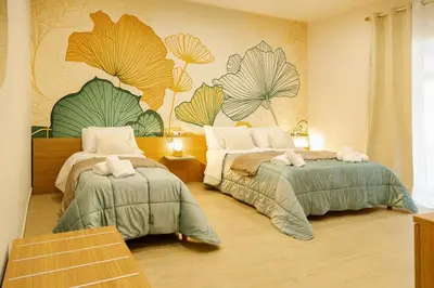 Letto o letti in una camera di A casa di Leo Rooms